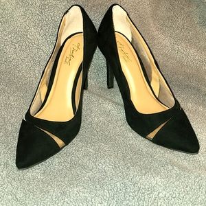 Thalia Sodi black heels with mesh sides.